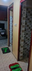 a room with a door and a room with greenprints at 2 Bedroom at Kamakis near Greenspot Long term 5 days plus in Ruiru
