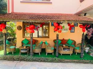 a model of a house with chairs and tables at Eco Resort in Dhulikhel