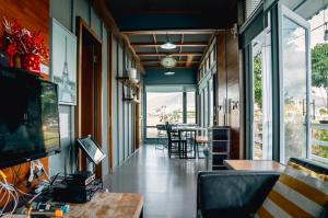 a hallway of a house with a table and chairs at Cape 42 Hotel Ill in Hengchun South Gate