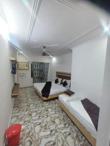 Voodi või voodid majutusasutuse the relax in hotel toas