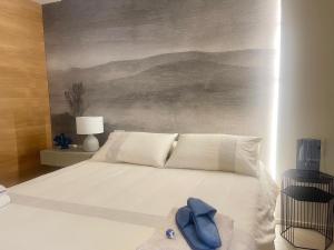 Postel nebo postele na pokoji v ubytování Sandy - Scala dei Turchi apartment