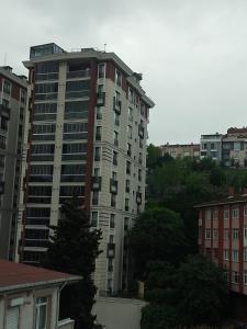 a tall apartment building in the middle of a city at Miracle HYLen Hotel in Istanbul