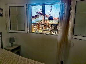 A bed or beds in a room at ILIAKTI RELAXING SEASIDE