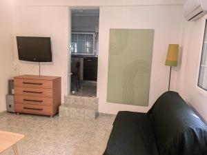 A television and/or entertainment centre at ILIAKTI RELAXING SEASIDE