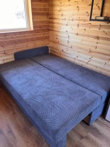 Säng eller sängar i ett rum på Katase Tiny House