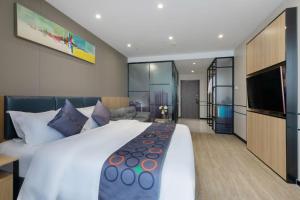 Ένα ή περισσότερα κρεβάτια σε δωμάτιο στο Yimi MIX International Apartment