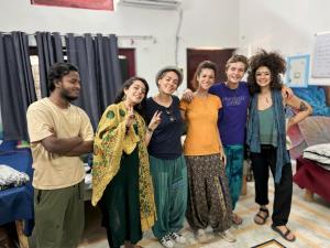 a group of people standing in a room at Manavi Hostel Near by Mathura Railway Station in Mathura