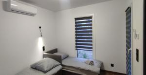 Postel nebo postele na pokoji v ubytování ECO HOUSE