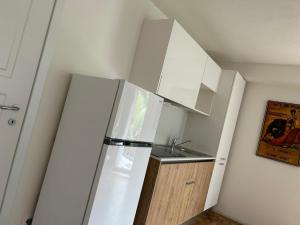 Kuchyň nebo kuchyňský kout v ubytování Residenza Sandrini