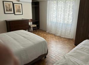 Postel nebo postele na pokoji v ubytování Residenza Sandrini