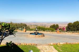 a fountain in the middle of a road at The Manor House at Dunn's Castle in Piketberg