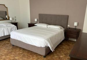 Postel nebo postele na pokoji v ubytování Residenza Sandrini
