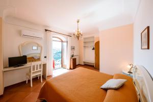Postelja oz. postelje v sobi nastanitve Albergo La Margherita