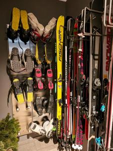 a bunch of skis and other ski equipment in a room at Grünseeappartement in Turracher Hohe