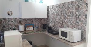 Kuchyň nebo kuchyňský kout v ubytování St Joseph Penthouse