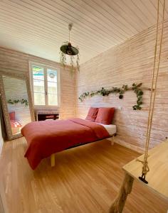 a bedroom with a swing bed in a room at ma calanque in Le Rove