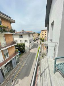 a view of a city street from a balcony at Bardolino Center Apartments in Bardolino +57 photos