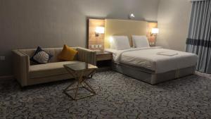 Voodi või voodid majutusasutuse فوربوينتس الشهباء Four points Alshahba toas