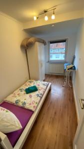 a bedroom with a bed in a room at gemütliche Wohnung in Bremen in Bremen