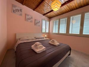 a bedroom with a bed with towels on it at Terra mia in Naples