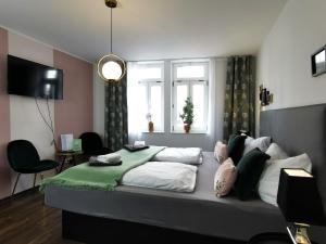 En eller flere senge i et værelse på BohnApartments Am Anger - Zentrum - Vollausstattung - WLAN