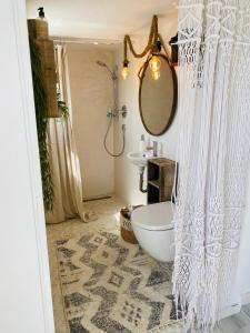 a bathroom with a white shower curtain and a sink at Relaxen am Wald in Stephanshausen in Stephanshausen +12 photos