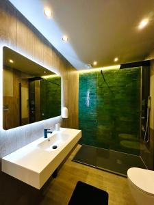 a bathroom with a sink and a shower at Spera Luxury in Monreale