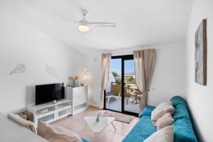 Et tv og/eller underholdning på Amarilla Golf Apartment