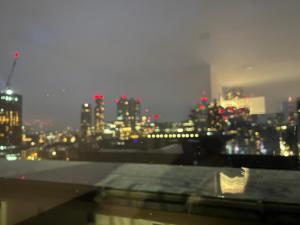 a view of a city skyline at night at Studio Shoreditch in London