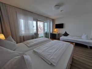 Postel nebo postele na pokoji v ubytování Apart Hotel Freiburg