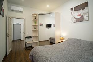 Апартаменты в Аркадии - Arcadia Sky Apartments客房内的一张或多张床位