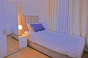 Postel nebo postele na pokoji v ubytování Hotel La Casa Blanca