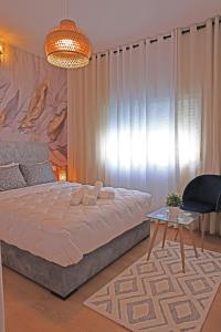 Postel nebo postele na pokoji v ubytování Hotel La Casa Blanca