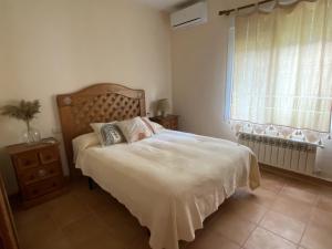Casa el Capricho del lago Alojamiento rural tesisinde bir odada yatak veya yataklar