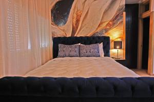 Postel nebo postele na pokoji v ubytování Hotel La Casa Blanca