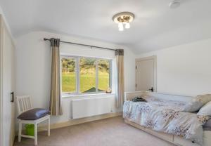 Кровать или кровати в номере Teach Eile, Clifden