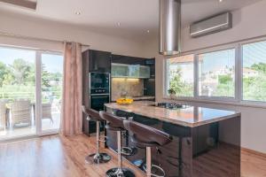 Kuchyň nebo kuchyňský kout v ubytování Villa Kora - luxury holiday Apartments