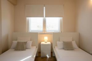 Postel nebo postele na pokoji v ubytování Villa Kora - luxury holiday Apartments