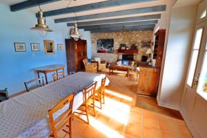 a kitchen and living room with a table and chairs at 687-Villa Kerguelen a 100m de la plage in Audierne +22 photos