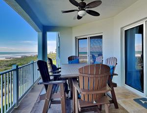 a dining room with a table and chairs on a balcony at 832 Cinnamon Beach, 3 Bedroom, Sleeps 8, Ocean Front, 2 Pools, Elevator in Palm Coast