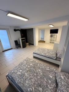 a large room with two beds and a couch at Schöne Apartments im Zentrum von Bottrop BM01 und BM02 in Bottrop