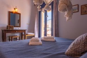 Posteľ alebo postele v izbe v ubytovaní Chara's Residence