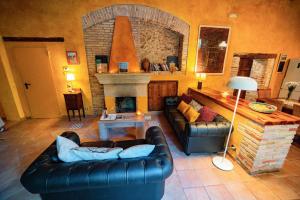 a living room with a couch and a fireplace at Catalunya Casas Rustic Vibes Villa with private pool 12km to beach in Vilafranca del Penedès