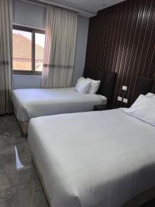 Rúm í herbergi á Mount of Olives Hotel