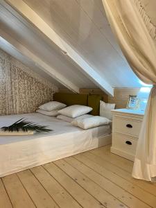 a bedroom with a bed and a dresser at Katerina 1 Bedroom House in Zakynthos