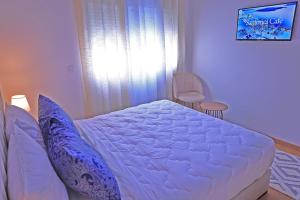 Postel nebo postele na pokoji v ubytování Hotel La Casa Blanca