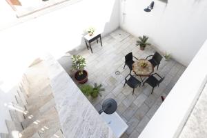 an overhead view of a room with a table and chairs at Casa Beatrice in Caprarica di Lecce