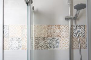 a bathroom with a shower curtain and a window at Casa Beatrice in Caprarica di Lecce +16 photos