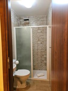 a bathroom with a toilet and a shower at Casa Nicole - Letojanni Taormina in Letojanni +19 photos