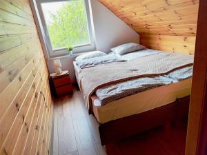 Postel nebo postele na pokoji v ubytování Domki Zagroda